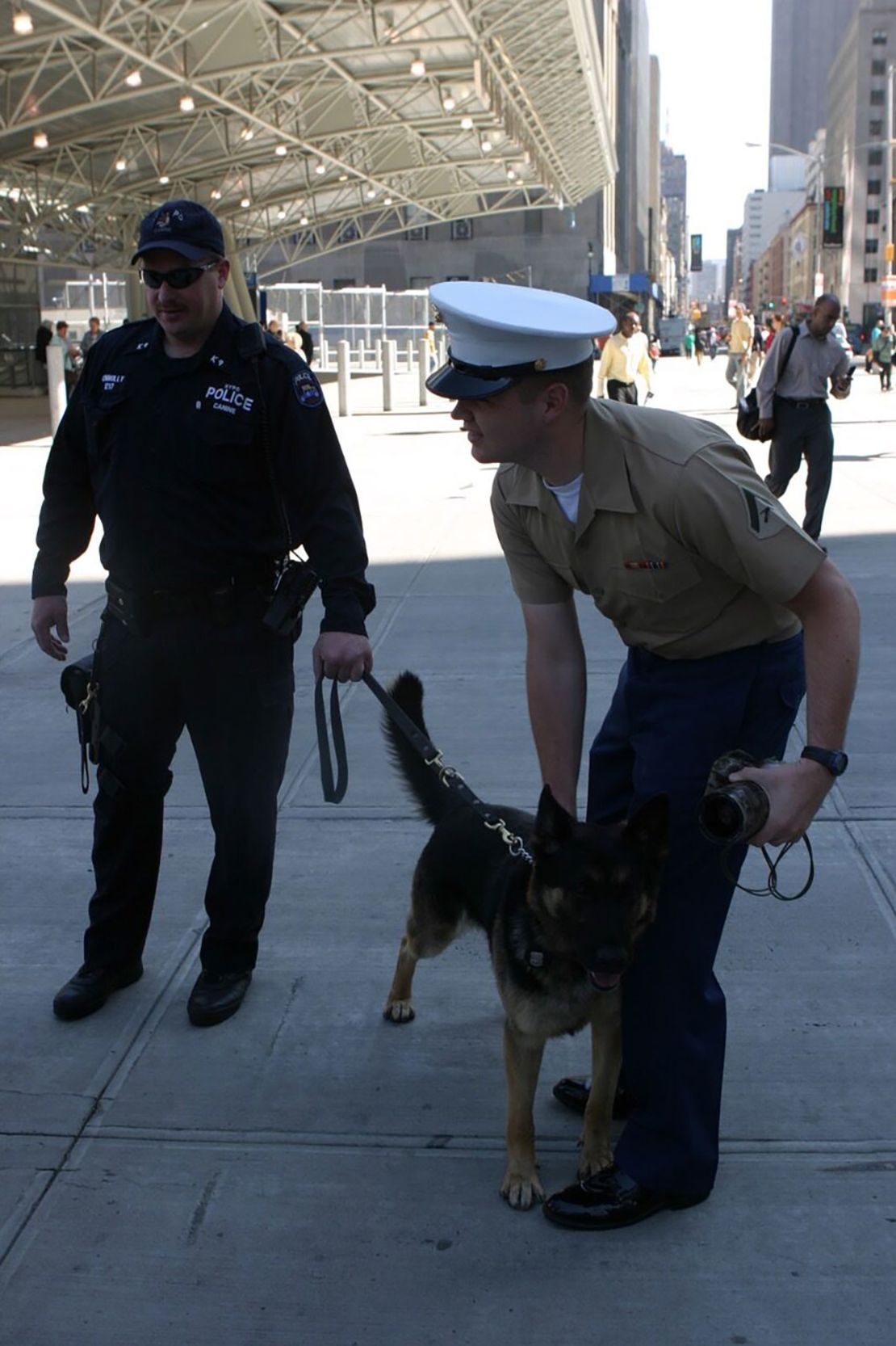 J.D. Vance petting a K-9 near Ground Zero while waiting for the 24th Marine Expeditionary Unit to arrive to lay a wreath at the site as part of the 18th annual Fleet Week in New York City in 2005.