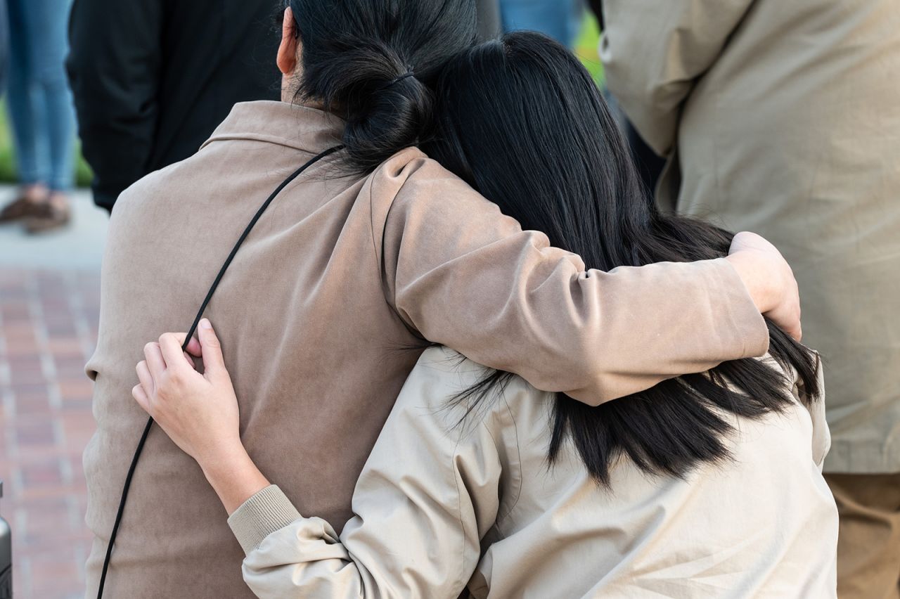 People gather during a vigil near the scene of the shooting in Monterey Park, California on January 22.