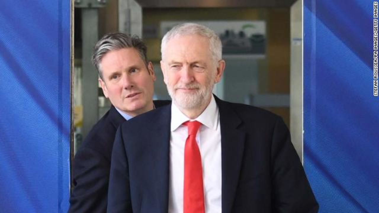 Labour party leader Jeremy Corbyn, followed by Brexit spokesman Keir Starmer