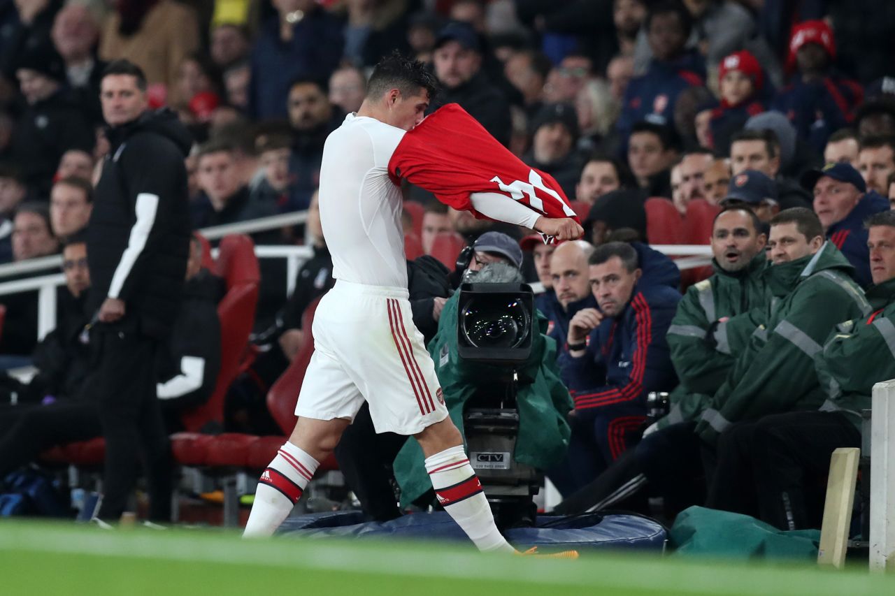 Granit Xhaka tears off his shirt after being booed by Arsenal supporters during the 2-2 draw with Crystal Palace.