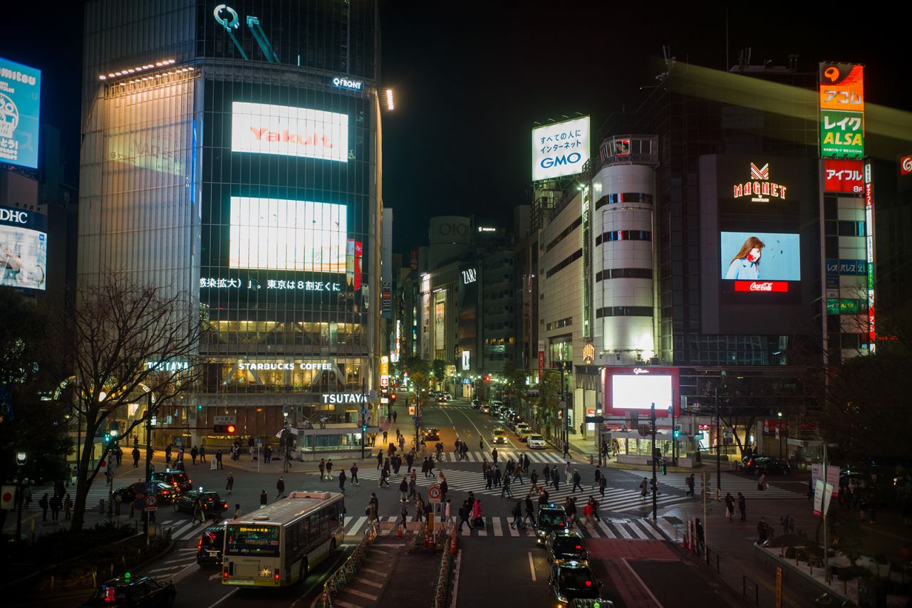 Pedestrians cross an intersection in the Shibuya district of Tokyo, on January 8.