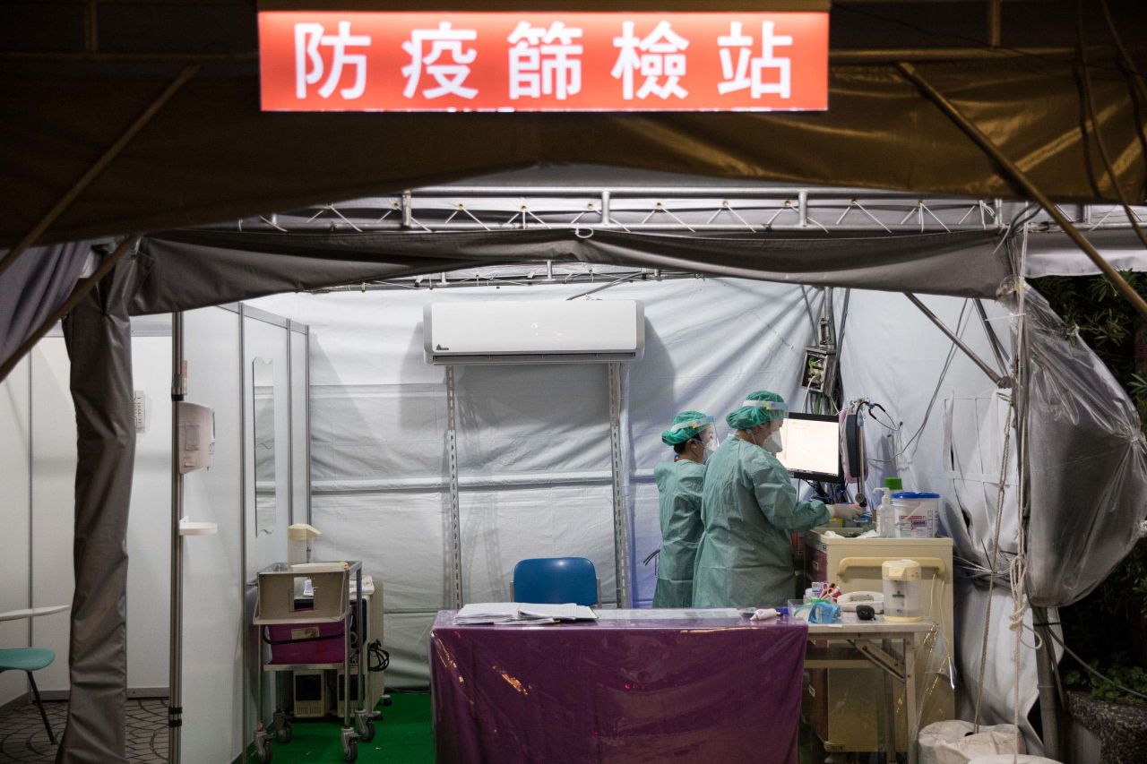 Medical personnel work in a coronavirus screening station at a hospital in Taipei, Taiwan, on March 30.