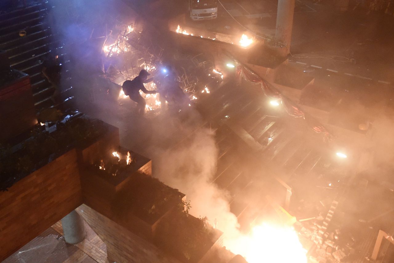 Protesters start a large fire at the main entrance of the Hong Kong Polytechnic University on November 18, 2019.