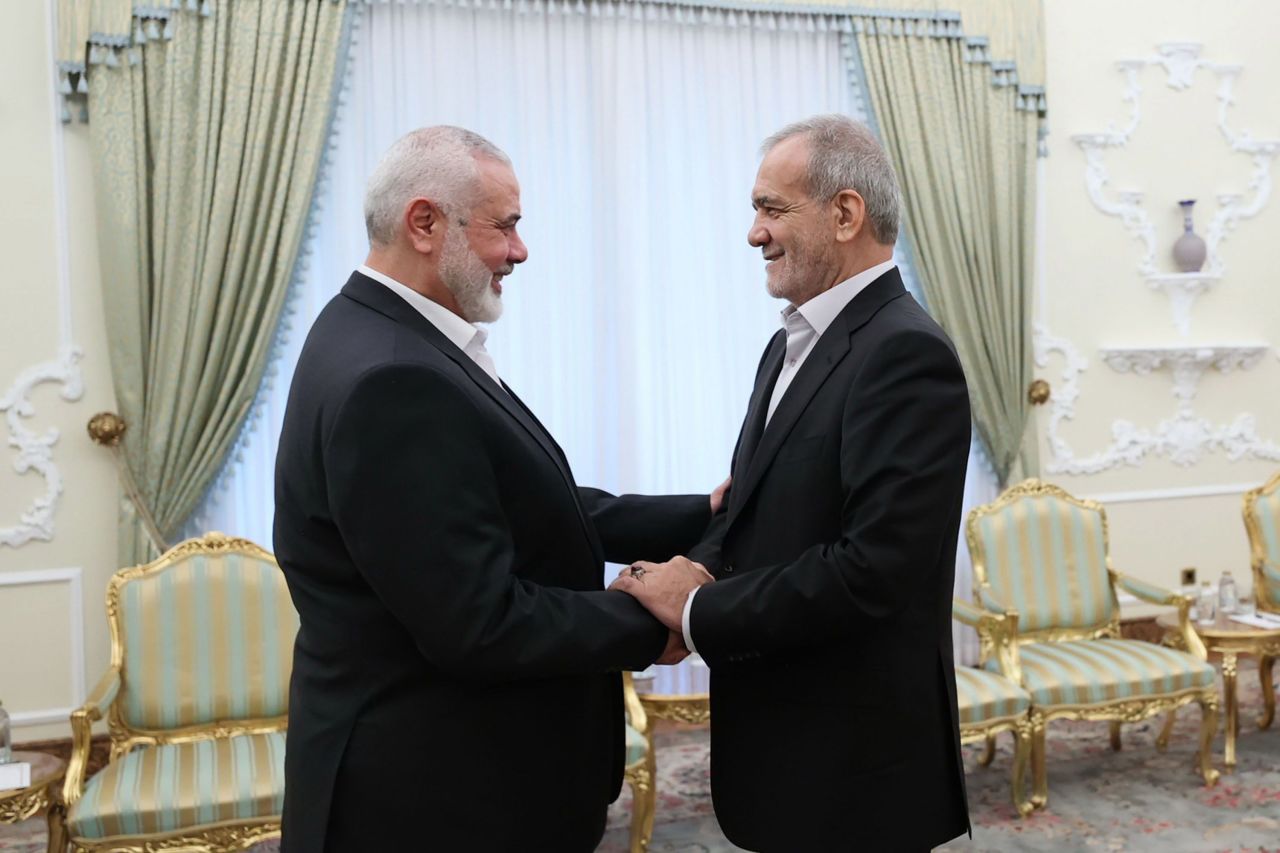 Hamas political leader Ismail Haniyeh, left, meets with Iranian President Masoud Pezeshkian, on July 30, in Tehran, Iran. 