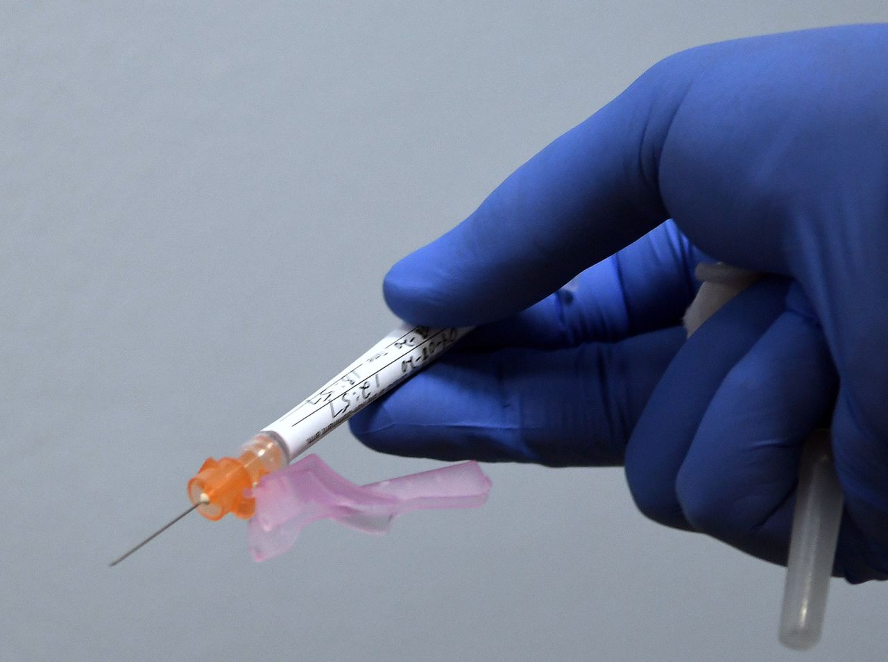 A syringe is prepared for use in Moderna's Covid-19 vaccine trial in DeLand, Florida, on August 4.