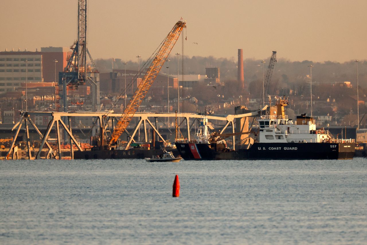 A crane works on the debris of the Francis Scott Key Bridge on March 29, in Baltimore, Maryland. 