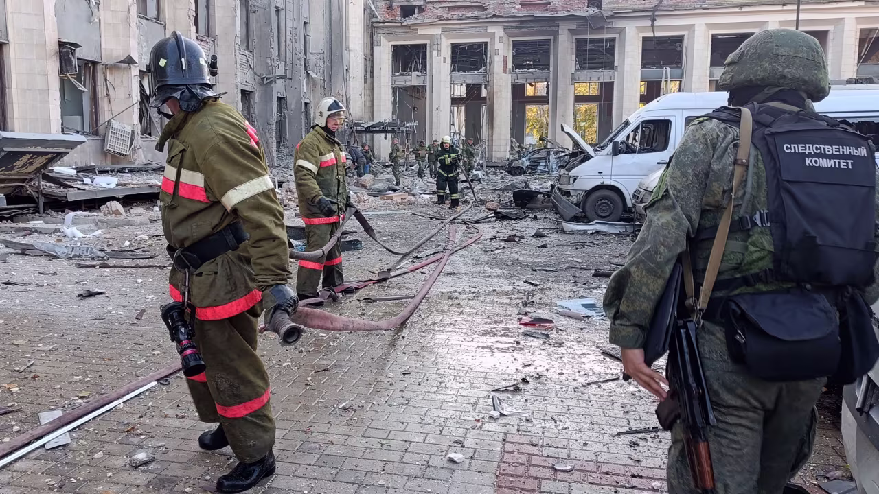 Firefighters conduct work after the administration building of Donetsk was hit with shelling on October 16. 