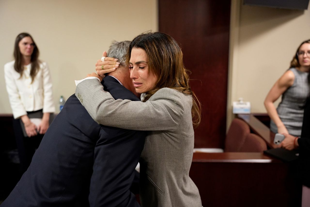 Alec Baldwin and his wife Hilaria Baldwin embrace before leaving the courtroom.