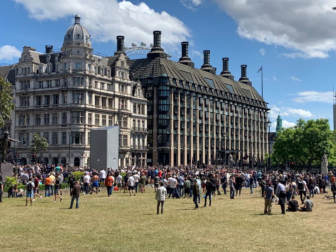 Protesters gathered in Parliament Square, London, on Saturday, where statues including one of Winston Churchill are boarded up.