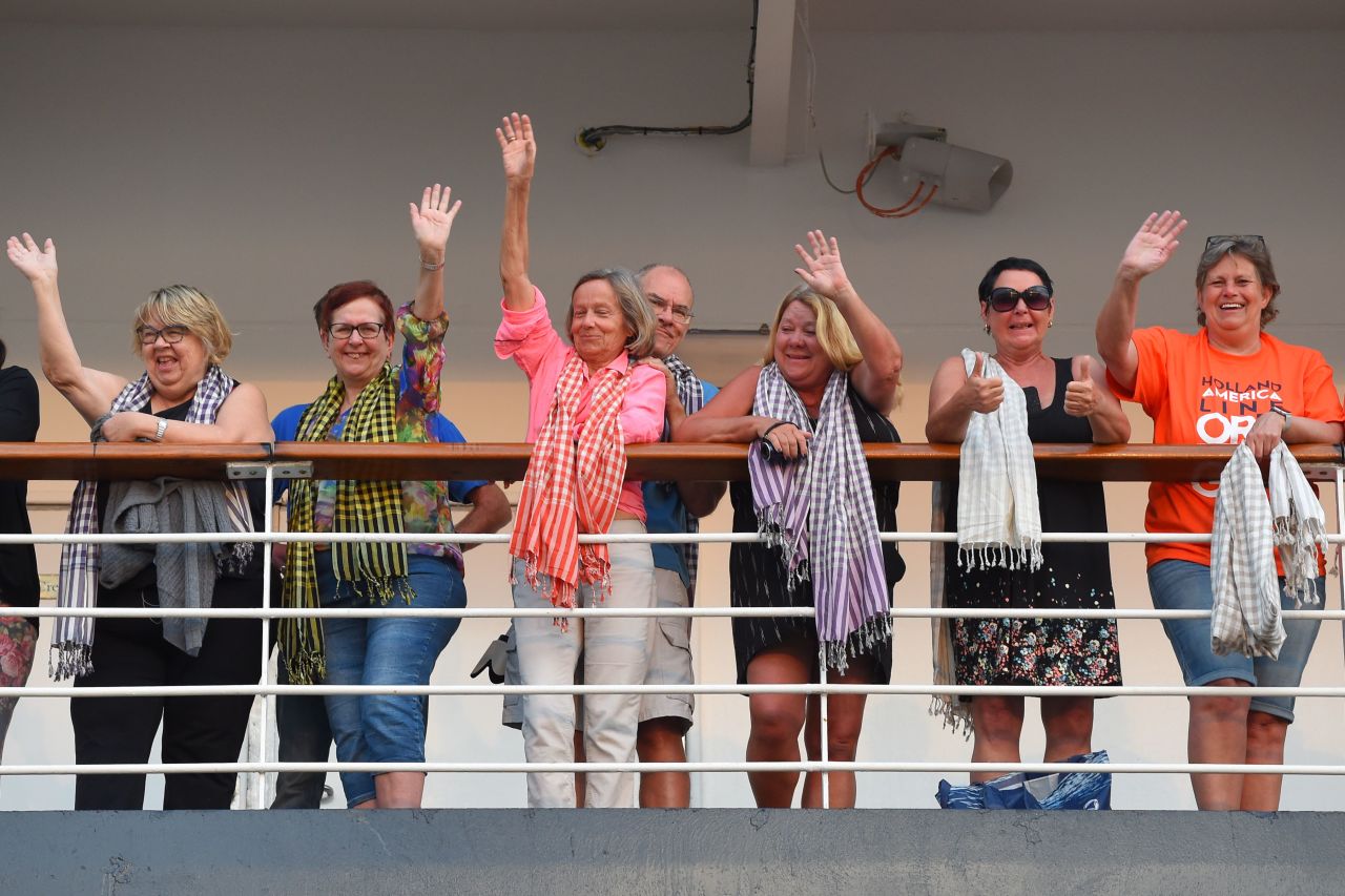 Passengers on board the Westerdam cruise ship wave in Sihanoukville, Cambodia on February 14.