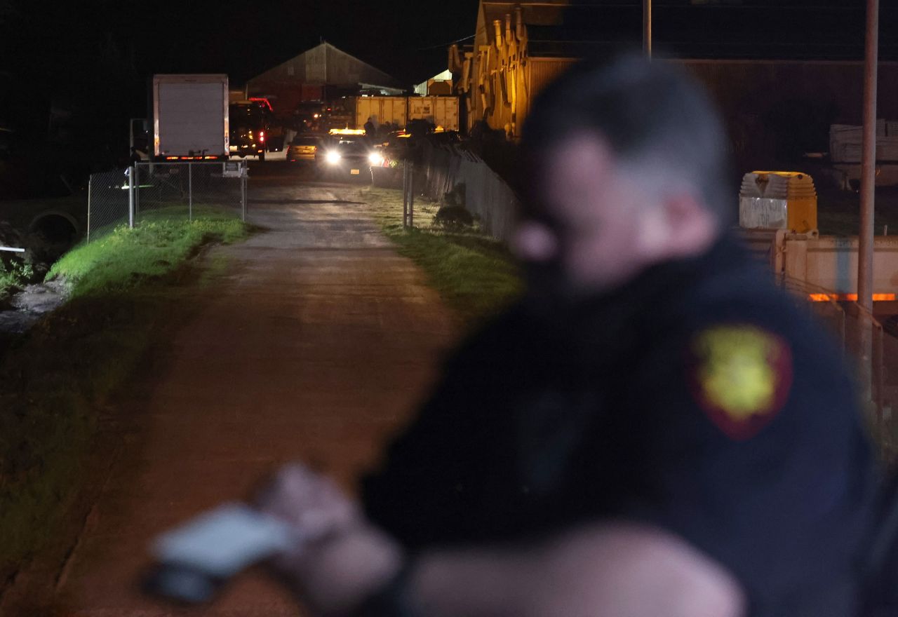 Law enforcement officials work at the scene of a shooting in Half Moon Bay, California, on Monday.