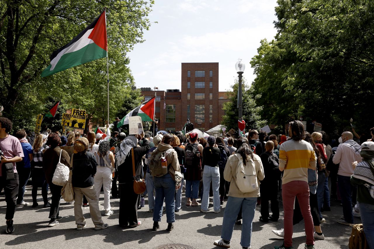 Activists and students protest on the outskirts of an encampment protest at the University Yard at George Washington University on April 26, in Washington, DC.