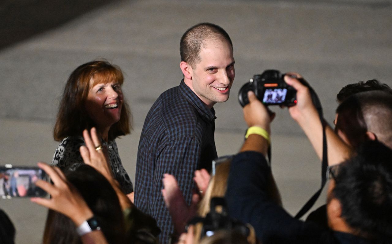 US journalist Evan Gershkovich followed by his mother Ella Milman, smiles as he arrives at Joint Base Andrews in Maryland on August 1.