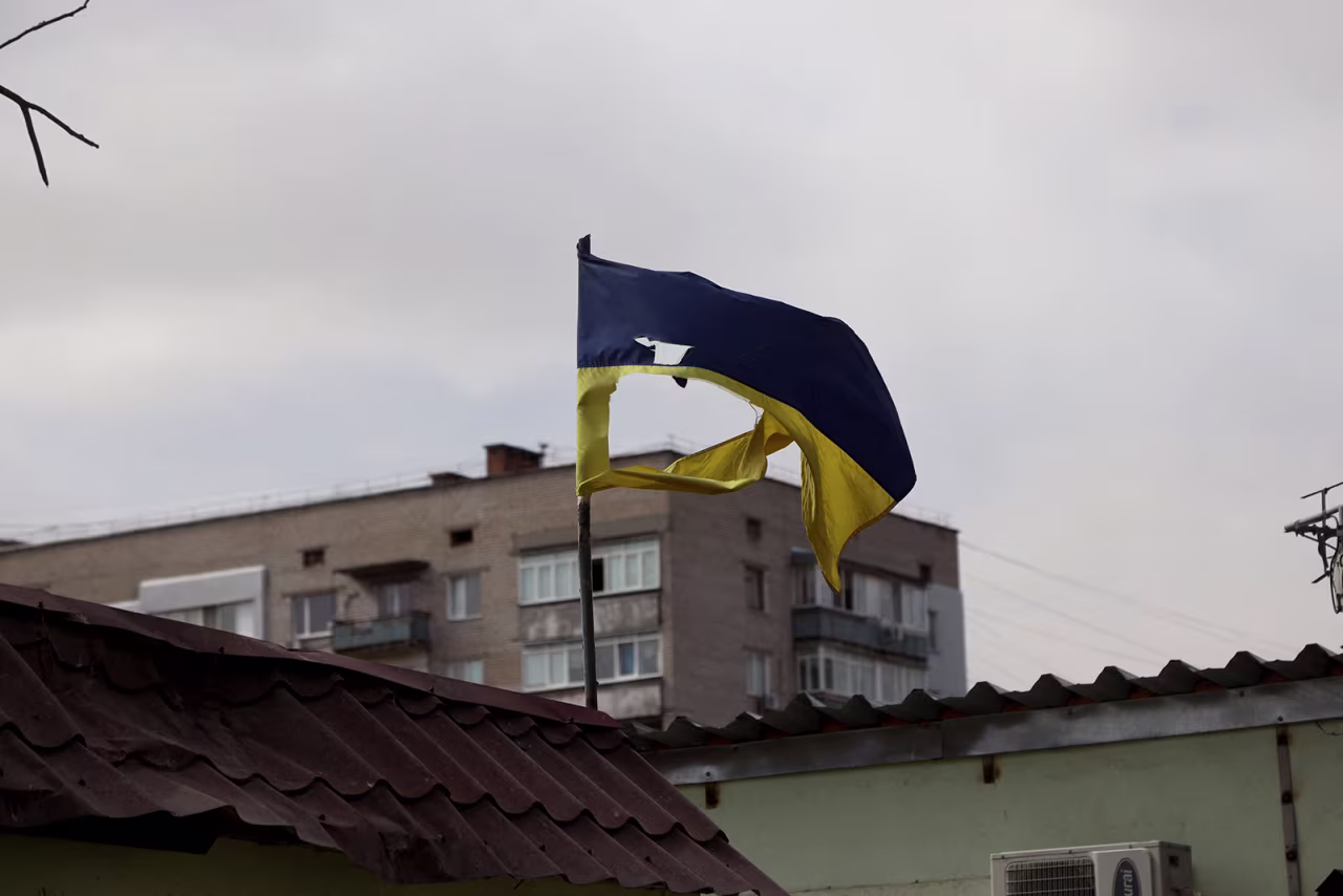 A Ukrainian flag torn by fragments after Russian shelling flutter in Mykolaiv, a key city on the road to Odessa, Ukraine's biggest port on March 27.