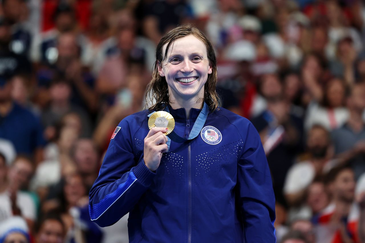 Gold Medalist Katie Ledecky of Team USA poses on the podium during the Swimming medal ceremony after the Women's 1500m Freestyle Final on July 31.