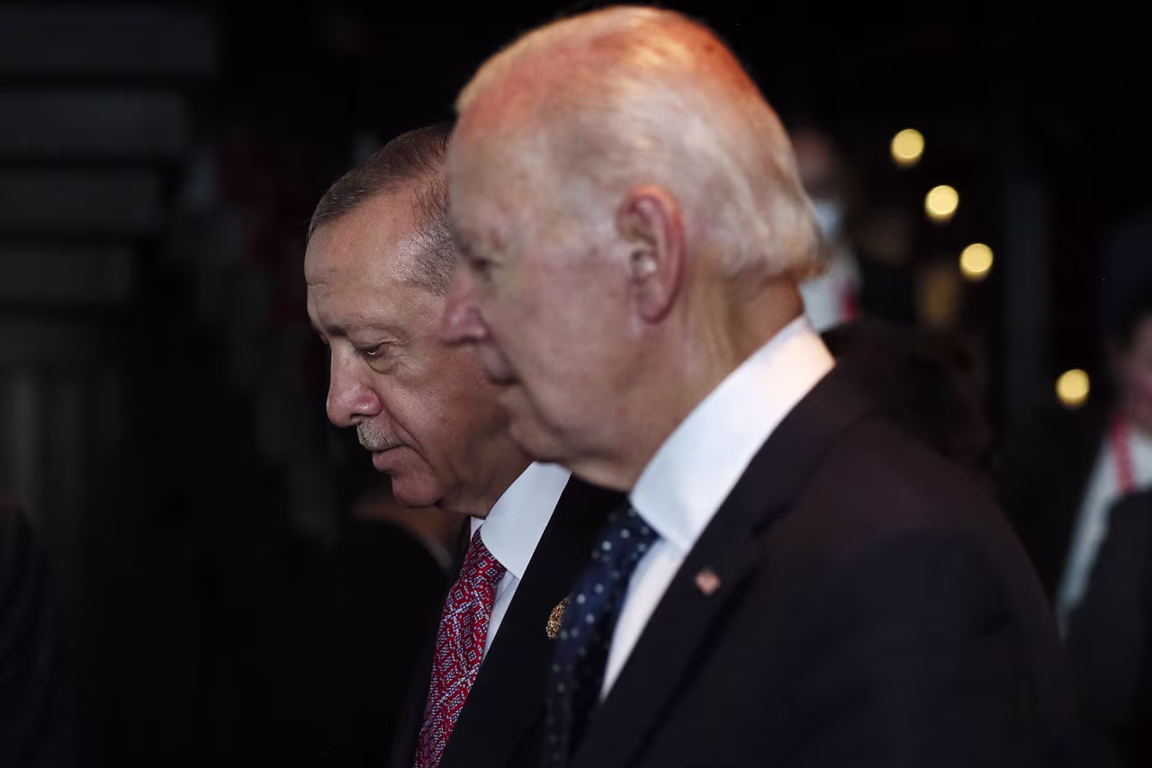 Turkish President Recep Tayyip Erdogan and US President Joe Biden walk during a meeting at the G20 summit in Bali, Indonesia, in November 2022.