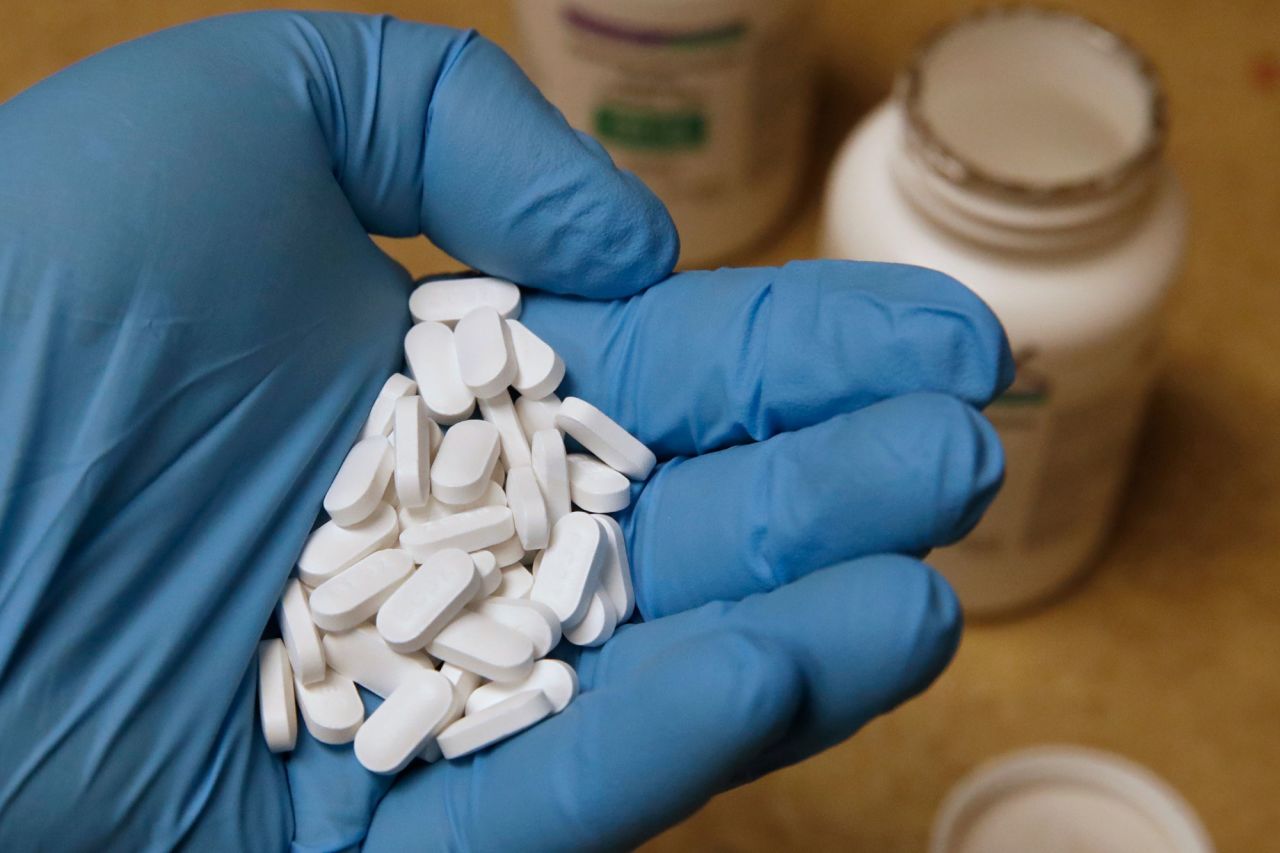 A pharmacy tech holds pills of Hydroxychloroquine at Rock Canyon Pharmacy in Provo, Utah, on May 20.