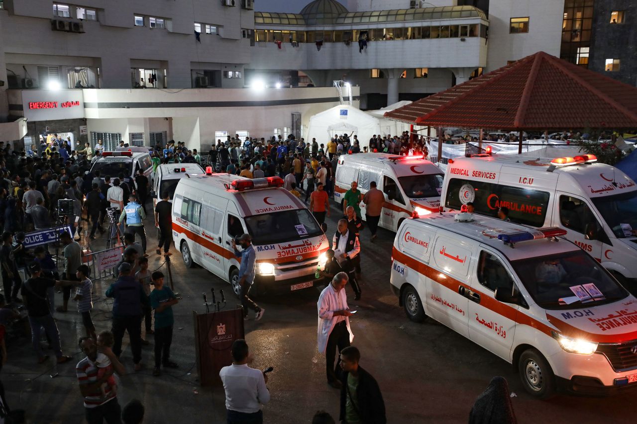 Ambulances carrying victims of Israeli strikes crowd the entrance to the emergency ward of Al Shifa hospital in Gaza City on October 15. 