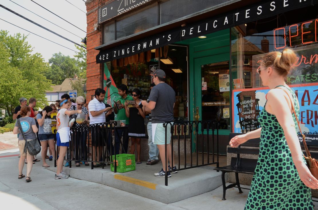 Customers wait to enter Zingerman's delicatessen, a popular Ann Arbor institution for more than 40 years. The deli offers dozens of sandwiches, from classic Reubens to vegetarian options.