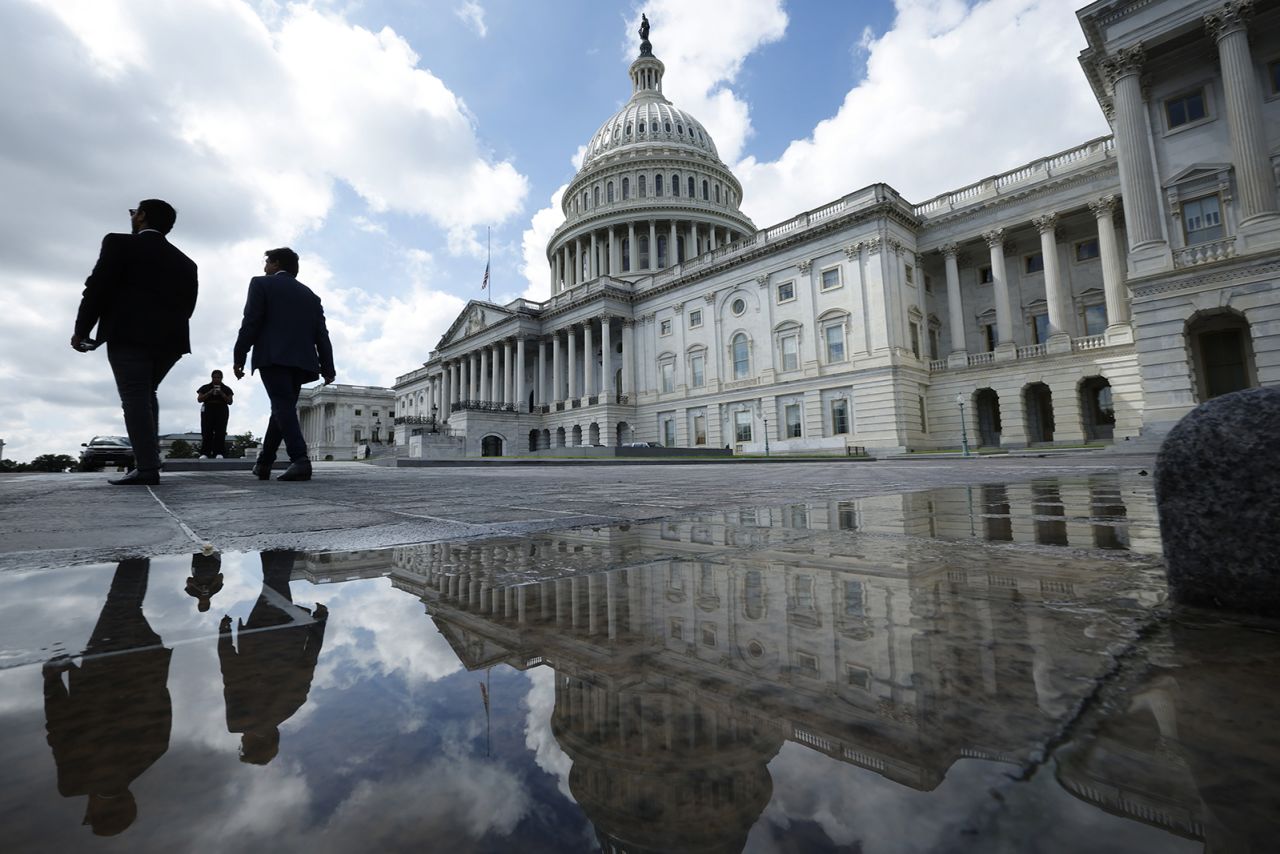 People walk past the U.S. Capitol on September 11, 2023 in Washington, DC.