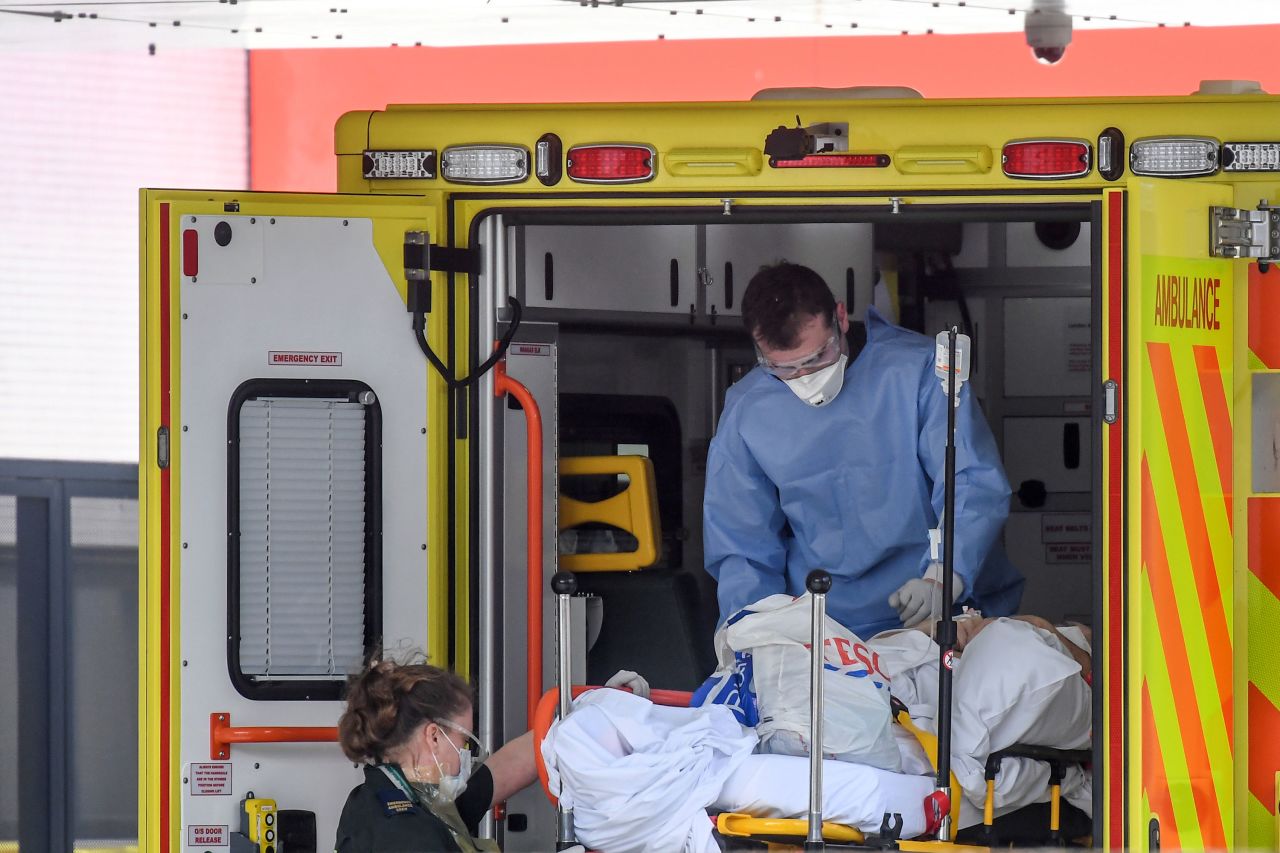 Doctors unload a patient outside St. Thomas' Hospital in London, on April 7.