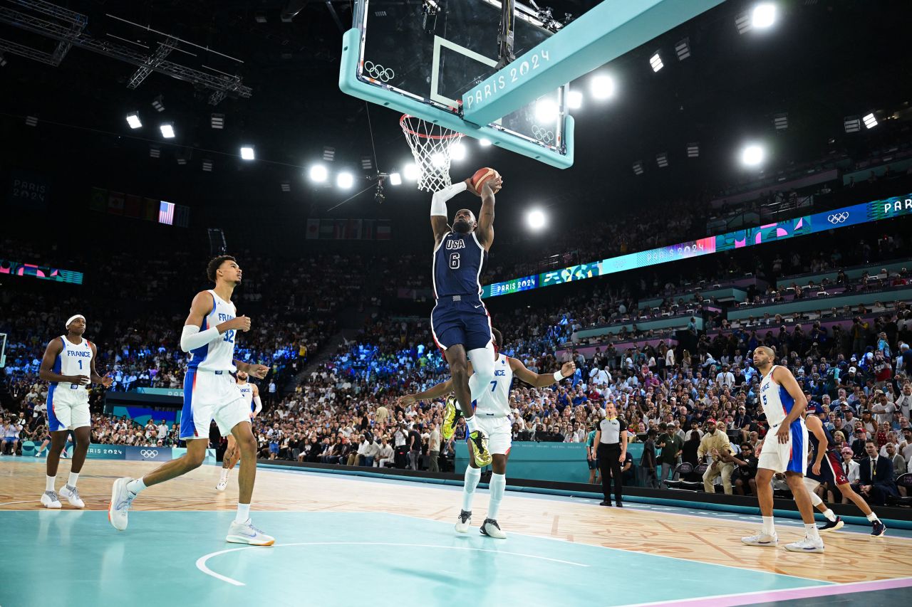 Team USA's LeBron James dunks the ball Saturday. 