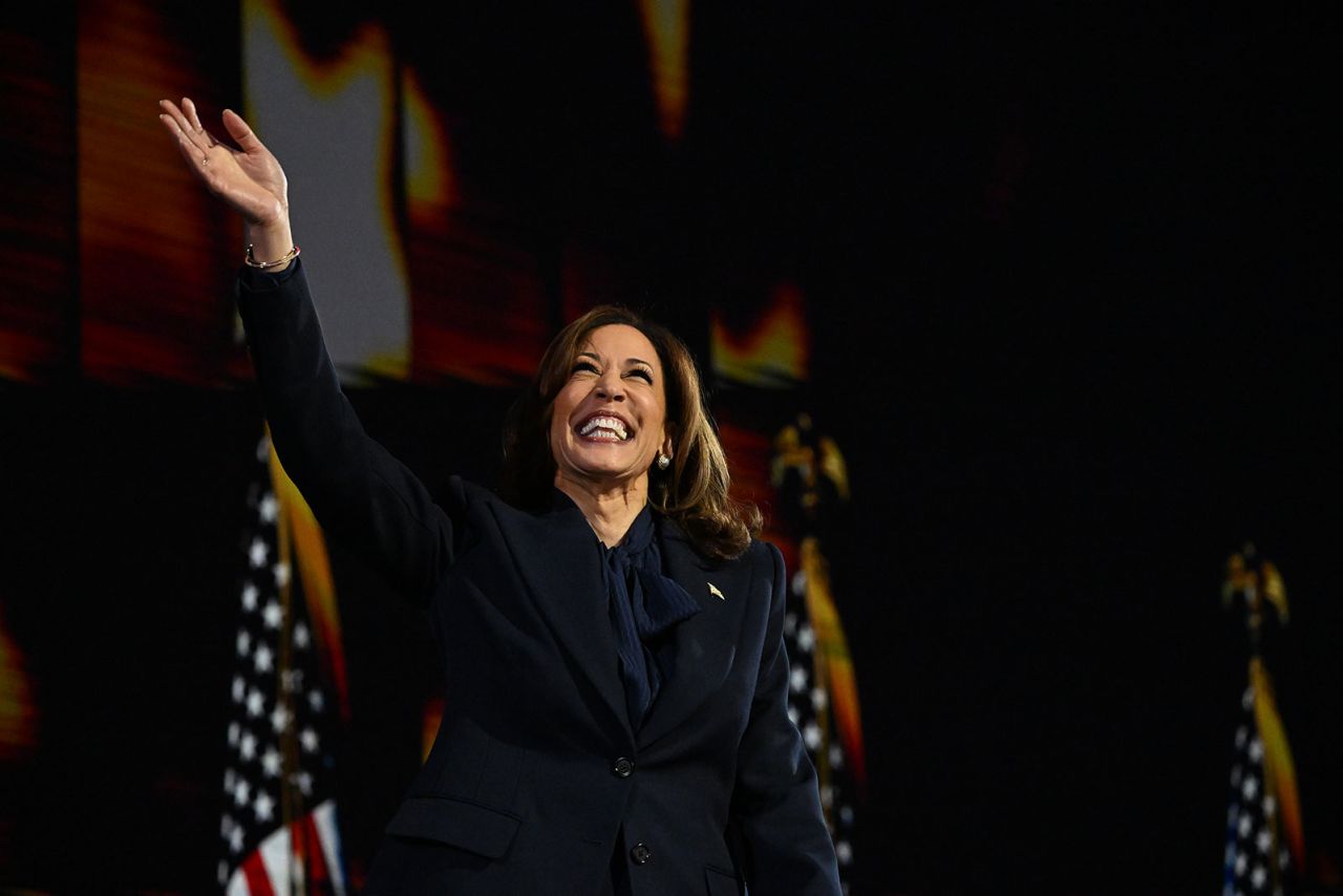 Vice President Kamala Harris waves on stage during the DNC on Thursday, August 22, in Chicago.