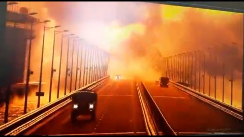 Surveillance footage from fixed cameras on the Kerch bridge shows the moment of a large explosion on the roadway, with some vehicles apparently caught in the blast on Saturday October 8.