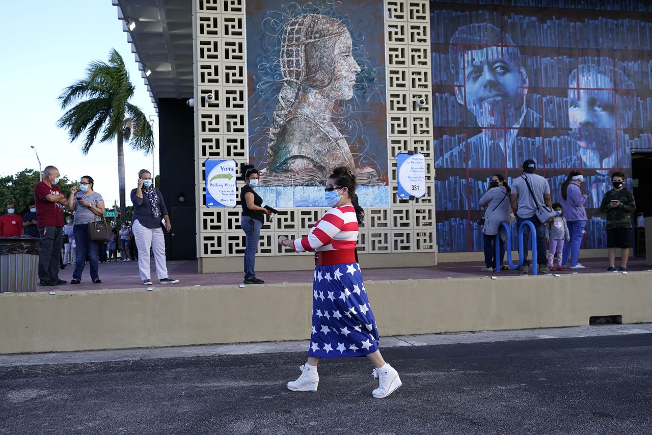 Yanitza Martinez wears red, white, and blue as she arrives to vote outside of the John F. Kennedy Library during the general election on Tuesday in Hialeah, Florida. 