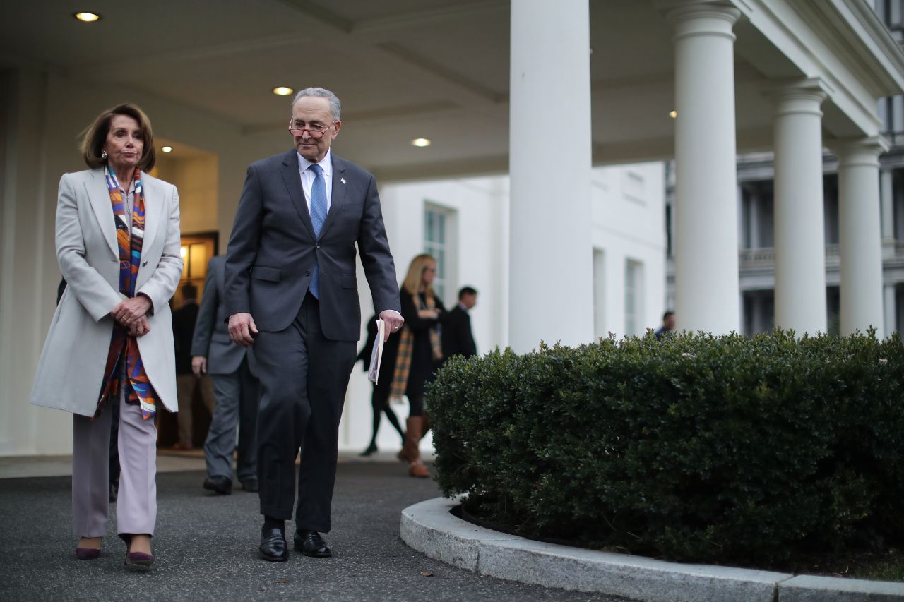 Democratic leaders Nancy Pelosi and Chuck Schumer leave the White House following a meeting with Trump on Wednesday.