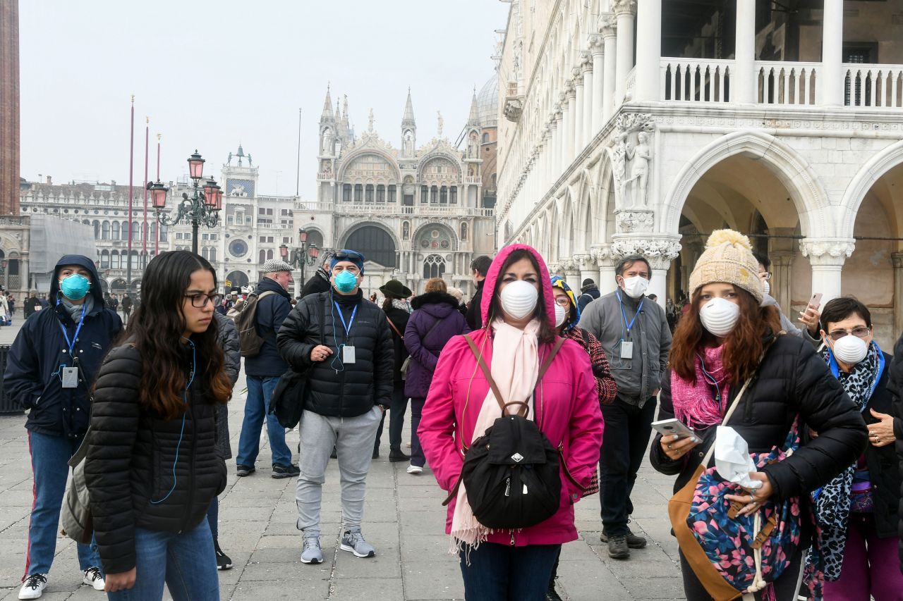 Tourists wearing face masks in Venice, Italy, on February 25.