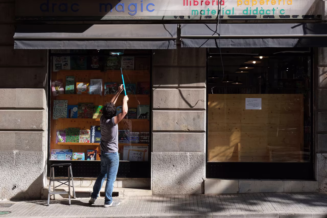 A woman opens her store in Palma de Mallorca during phase one of Spain's reopening.