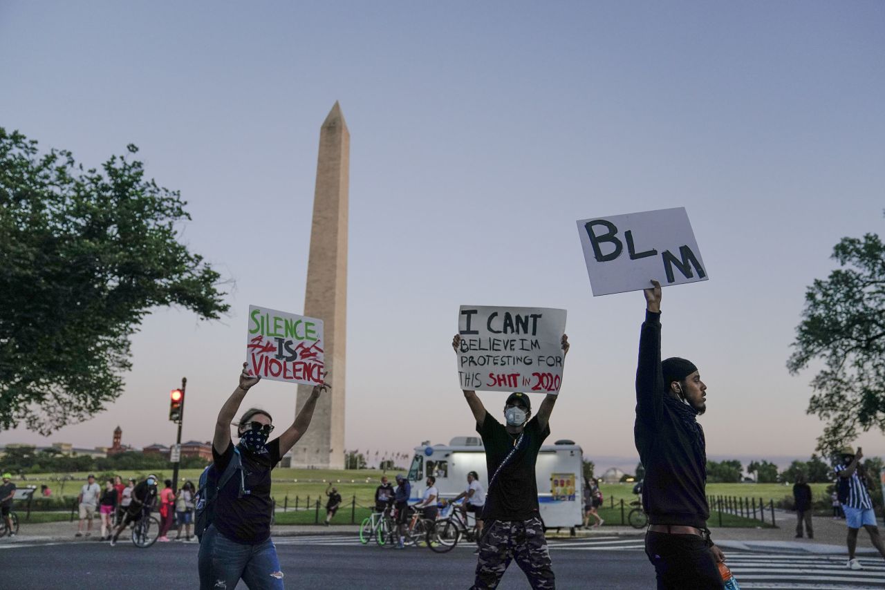 Demonstrators march past the Washington Monument as they protest the death of George Floyd, on Sunday, May 31. 