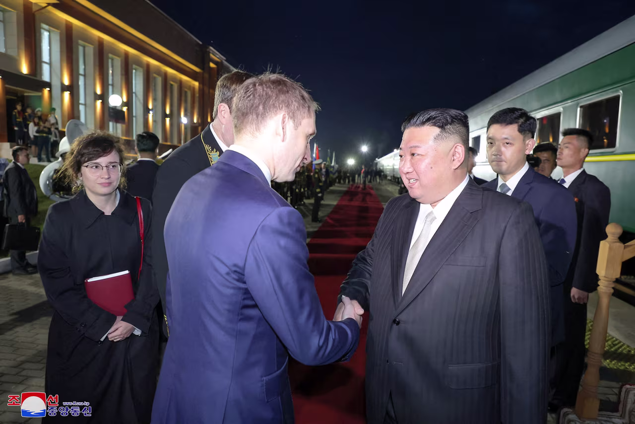 North Korean leader Kim Jong Un shakes hands with Russian Natural Resources Minister Alexander Kozlov in Khasan, Russia, on Tuesday, September 12.