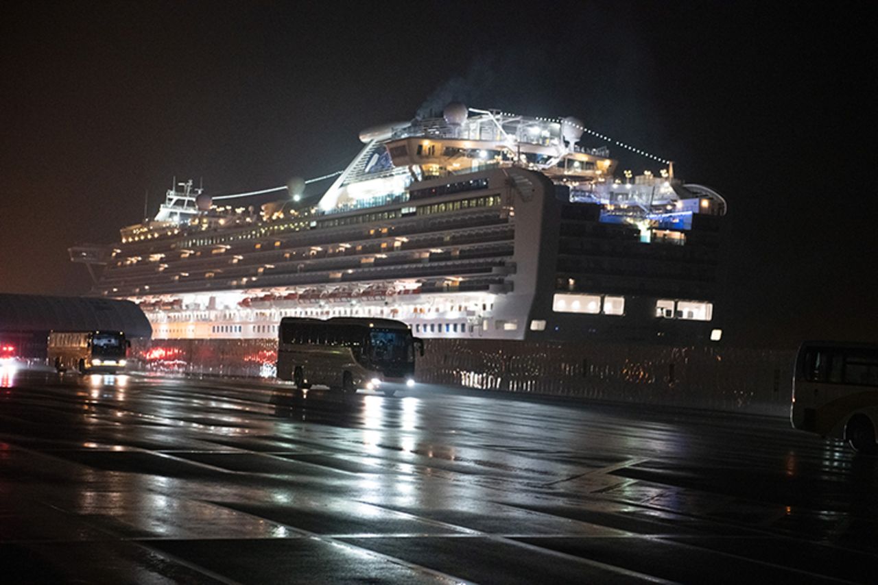 Buses carry American citizens from the quarantined Diamond Princess cruise ship at Daikoku Pier to be repatriated to the United States, on Monday, February 17, in Yokohama, Japan.