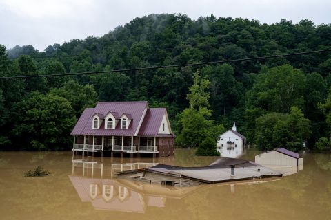 A house is seen almost completely submerged on July 29 in Breathitt County, Kentucky. 