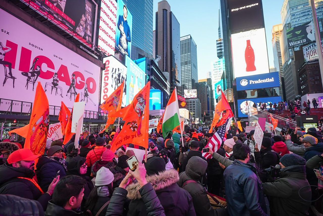 People celebrate ahead of the Ram temple opening in Ayodhya, India, at Times Square in New York on January 22.