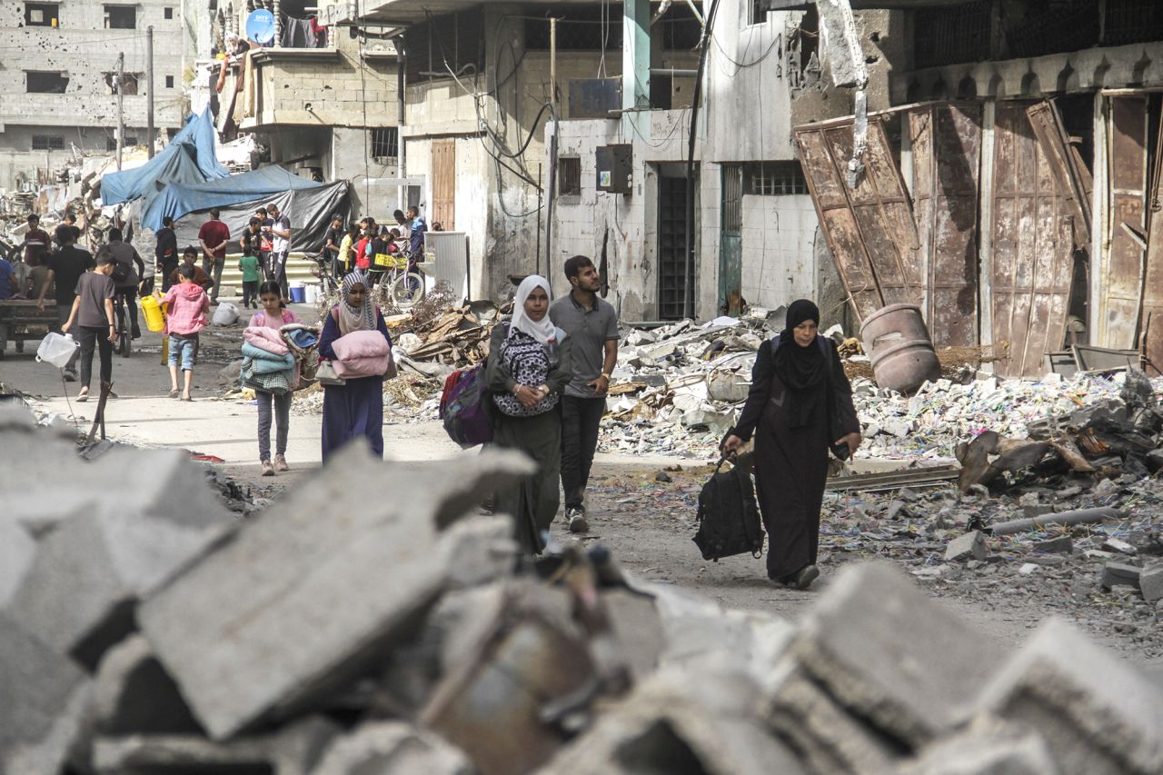 Palestinians leave Jabalya camp in northern Gaza on May 11.