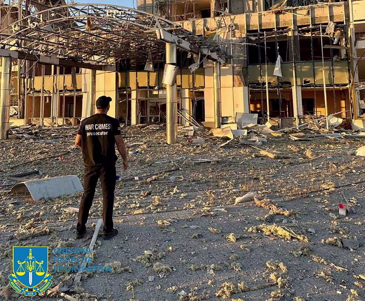 A member of Odesa Regional Prosecutor's Office personnel inspects damage following a Russian military attack in Odesa, Ukraine, in this image released on September 25.