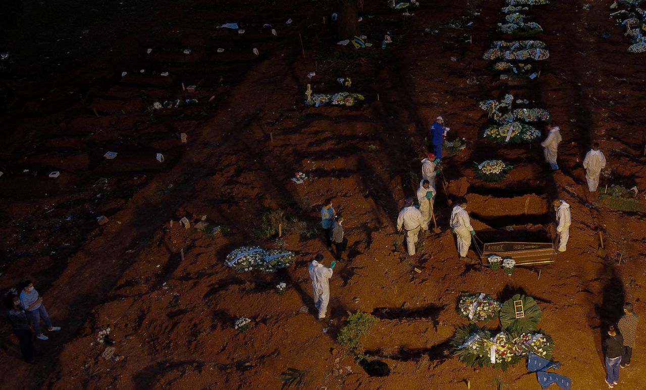 Workers bury a coffin at the Vila Formosa cemetery in Sao Paulo, Brazil, on April 17.