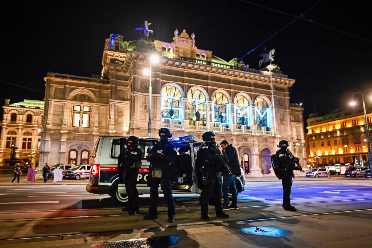 Heavily armed police stand outside the Vienna State Opera after shots were fired in the city center on Monday night. 