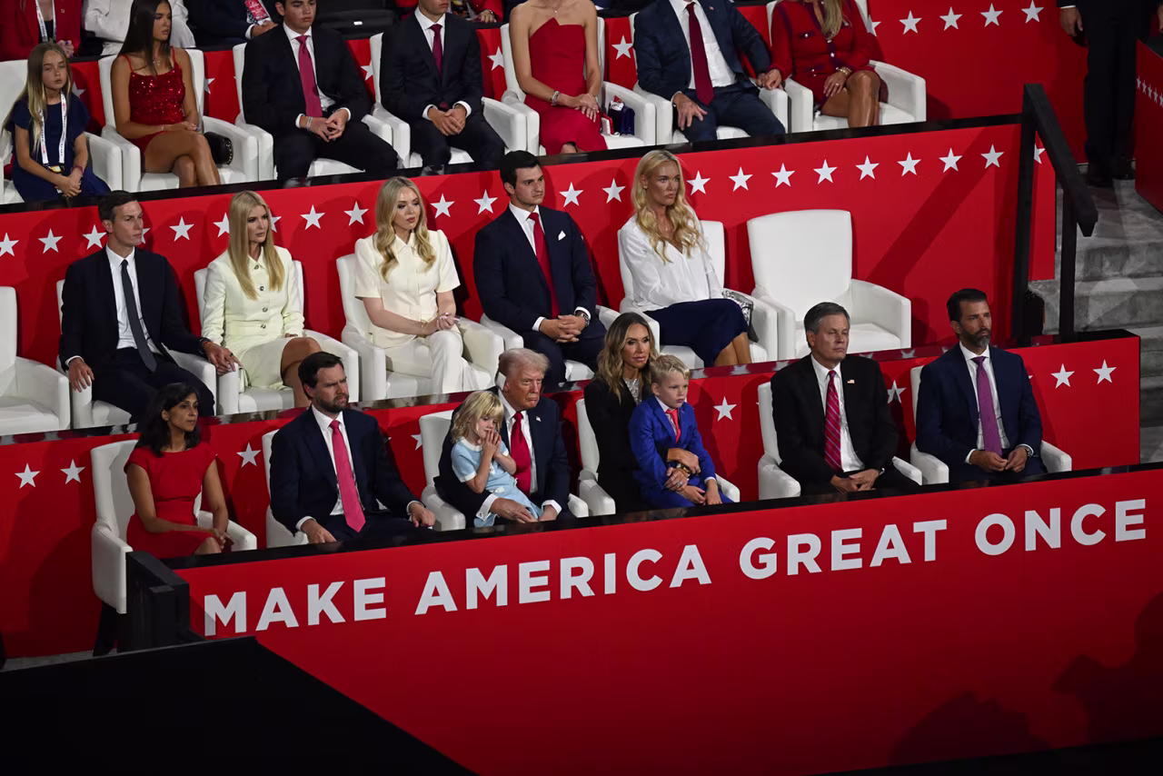 Trump listens to convention speakers with members of his family and special guests.