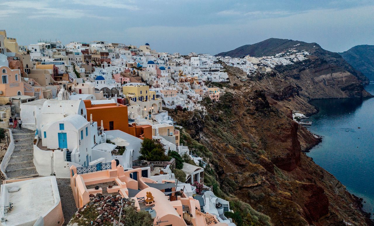 The village of Oia on the northwestern tip of the Greek island of Santorini on May 20. Greek Foreign Minister Nikos Dendias said that the gradual easing of restrictions should be completed by the end of June and expressed hope that Italians would choose Greece as their holiday destination.