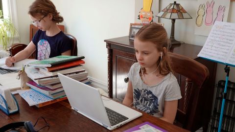 Children in New York do their schoolwork from home in April.
