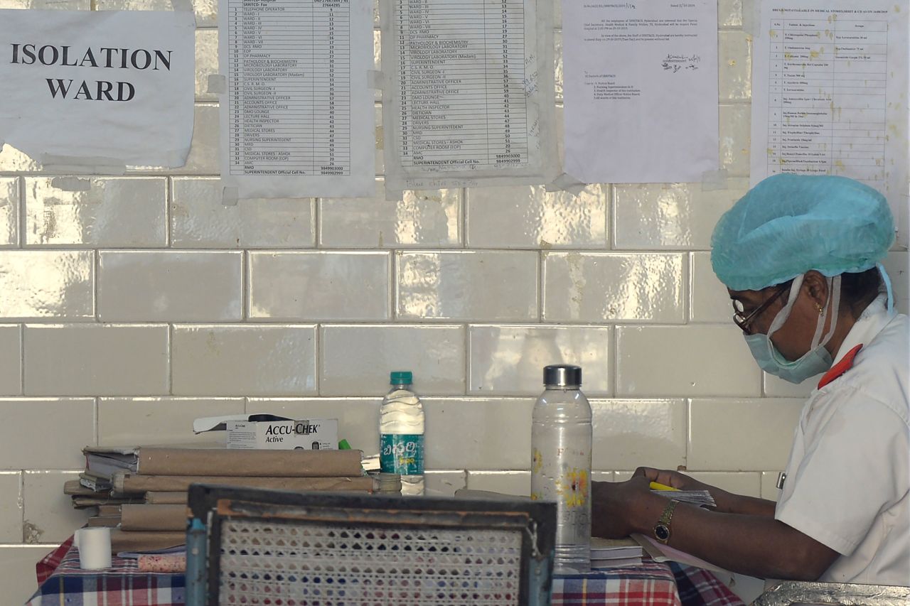 A medical nurse screening patients for coronavirus is seen inside an isolation ward in Hyderabad, India, on January 27. 