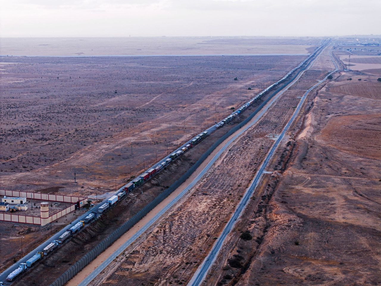 An aerial view shows a line of trucks queuing on a road along Egypt's border with Israel, near the Rafah crossing with Gaza, on May 2. 