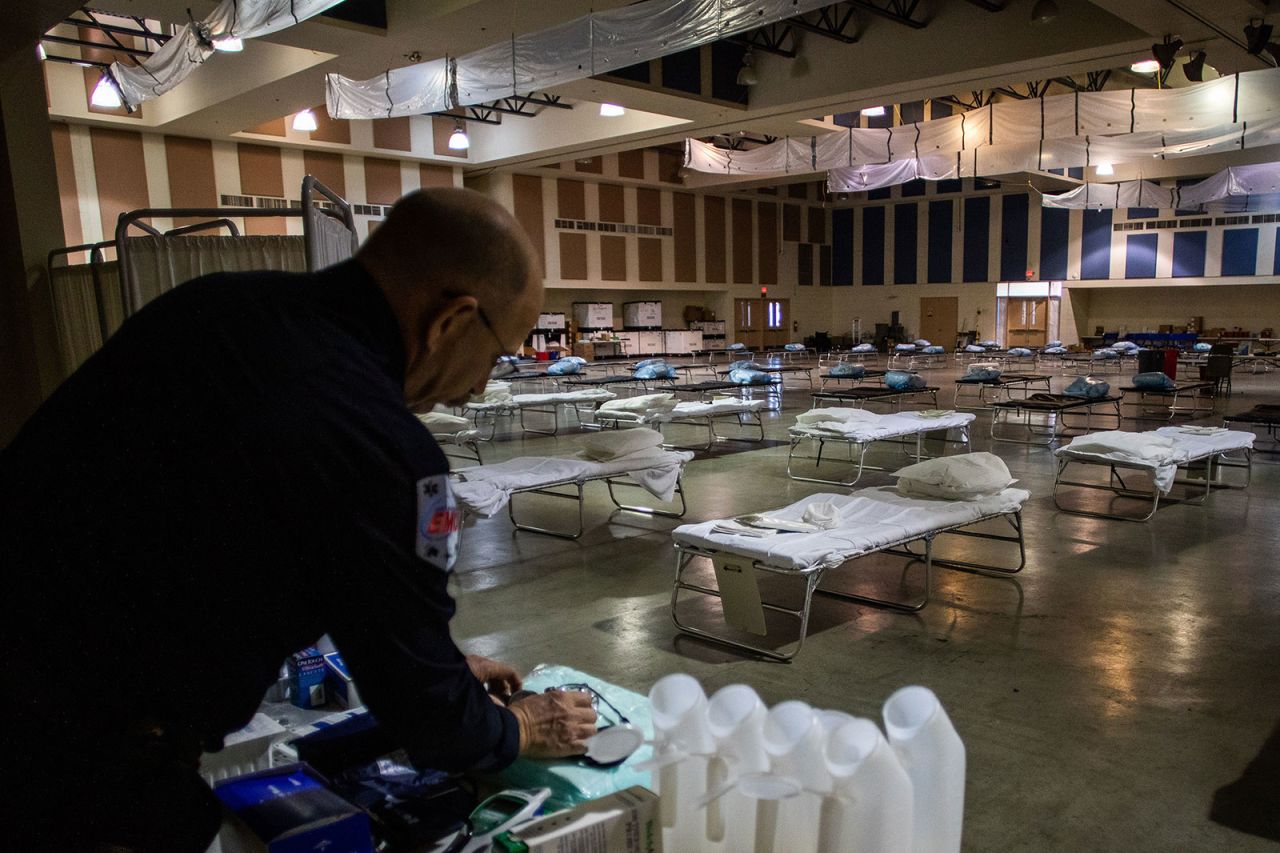 Health Public Information Officer Shane Reichardt organizes medical equipment inside a field hospital in Indio, California, on March 29.