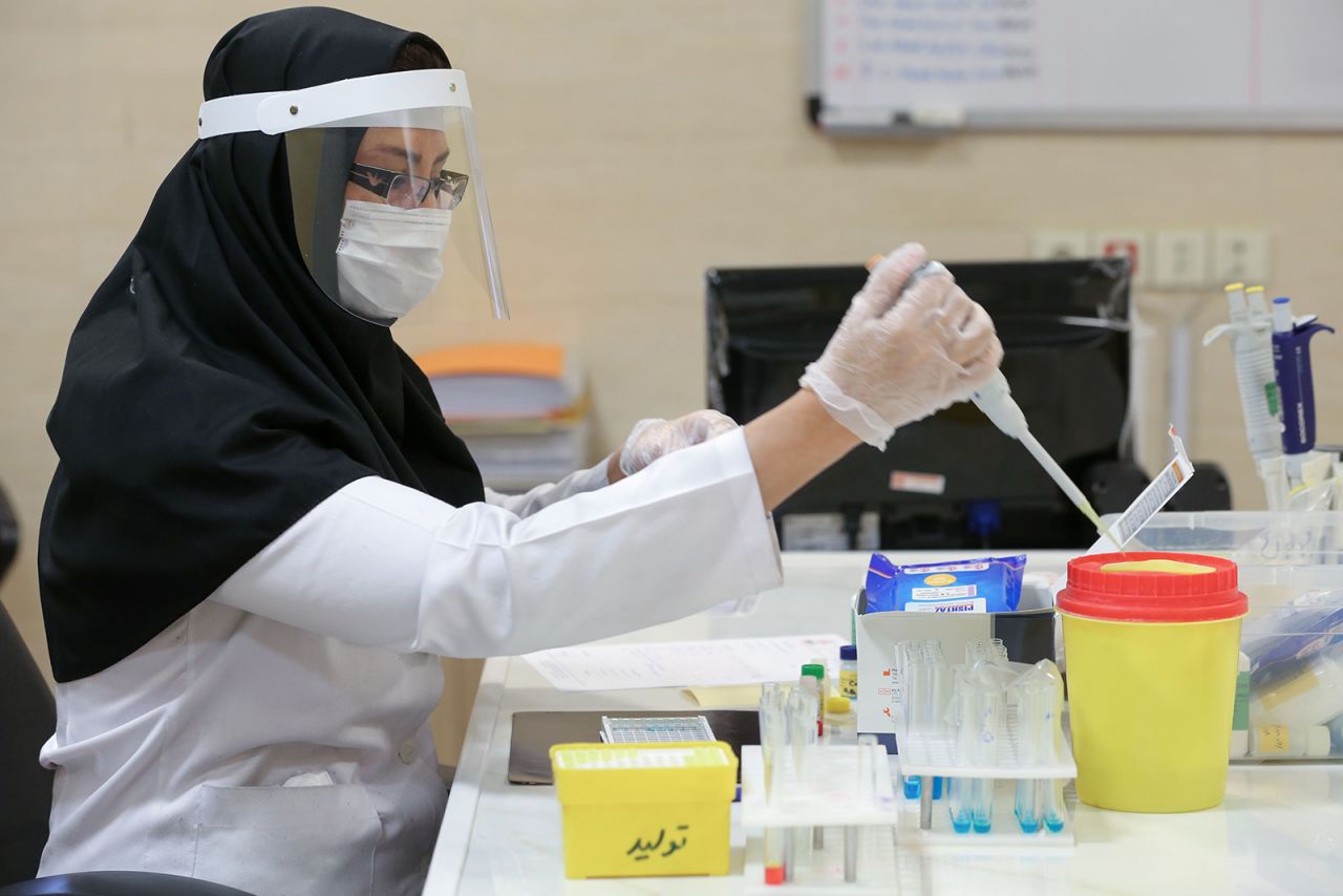 Medical staff works on the production of Covid-19 test kits at a medical center in Karaj, at the northern Alborz Province, Iran on April 11.