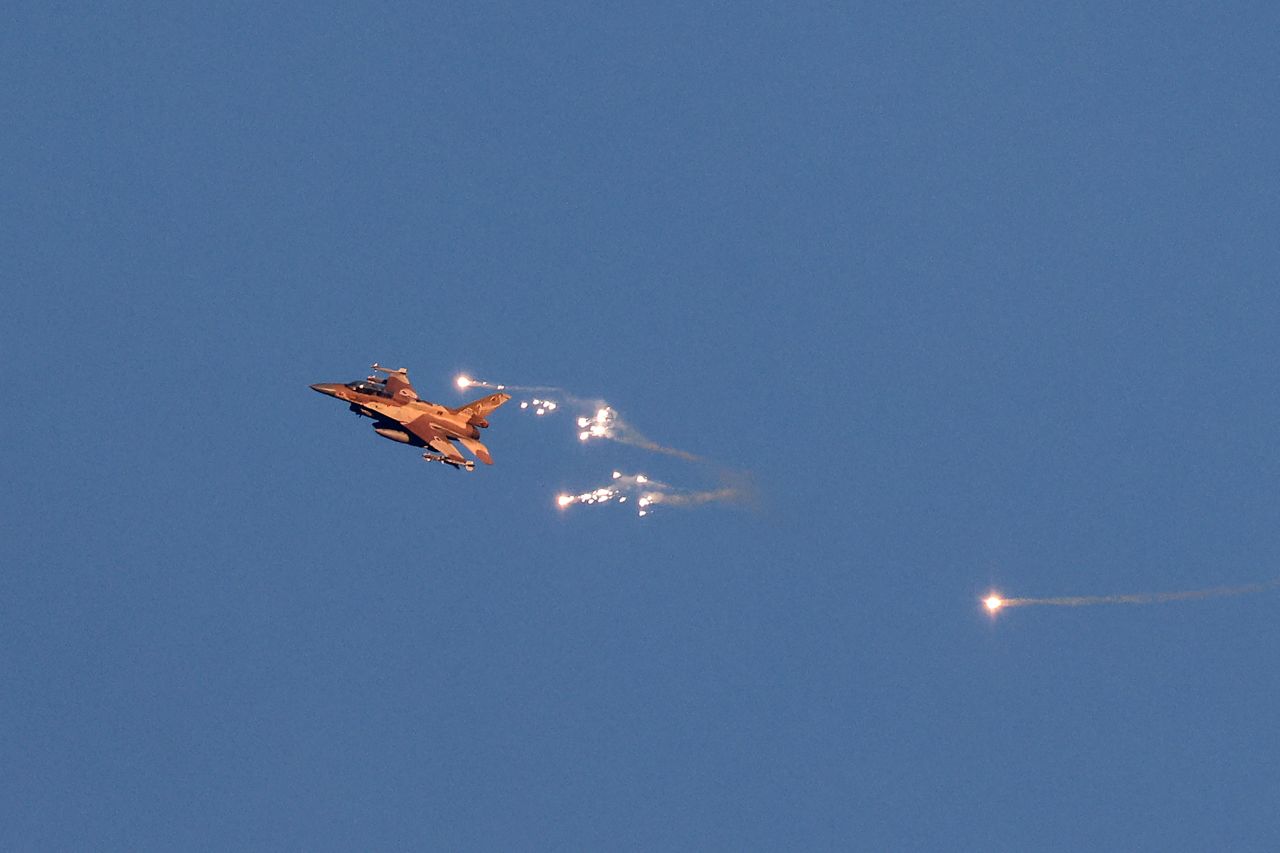 An Israeli Air Force fighter jet fires flares as it flies to intercept an aircraft launched from Lebanon on August 25. 