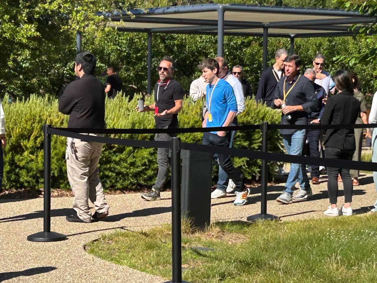 Sam Altman arrives at WWDC event with Apple executives. 